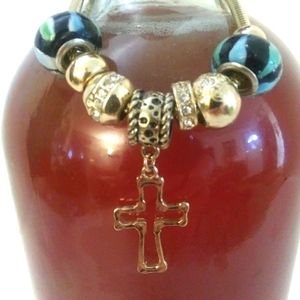 NWOT Beautiful Beaded Charm Braclet with a Gold Tone Blessing Cross Charm